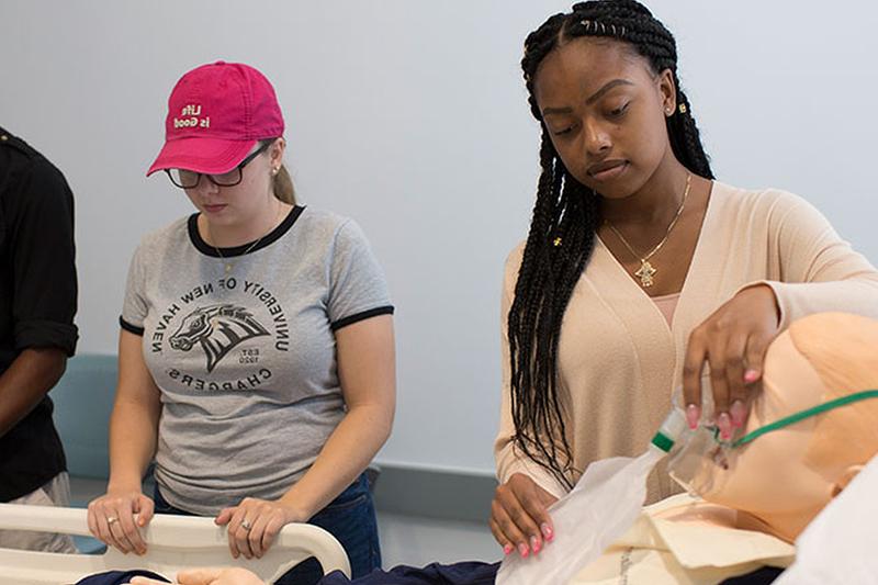 A Student examining mock crime scene evidence.